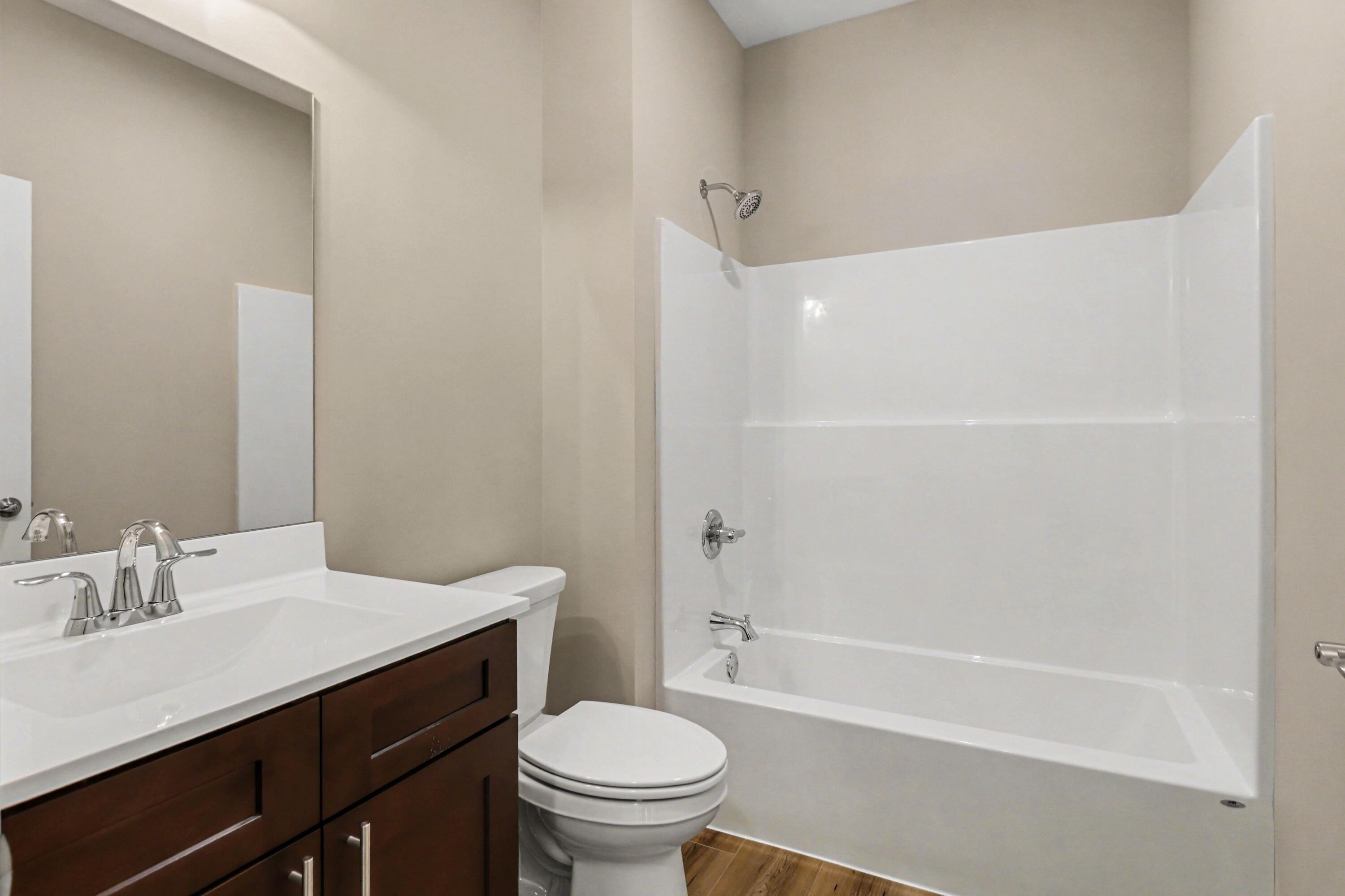 6071 Robbins Road Portage, IN 46368 - Photo 12 of 14 a bathroom with a sink a toilet and a bathtub