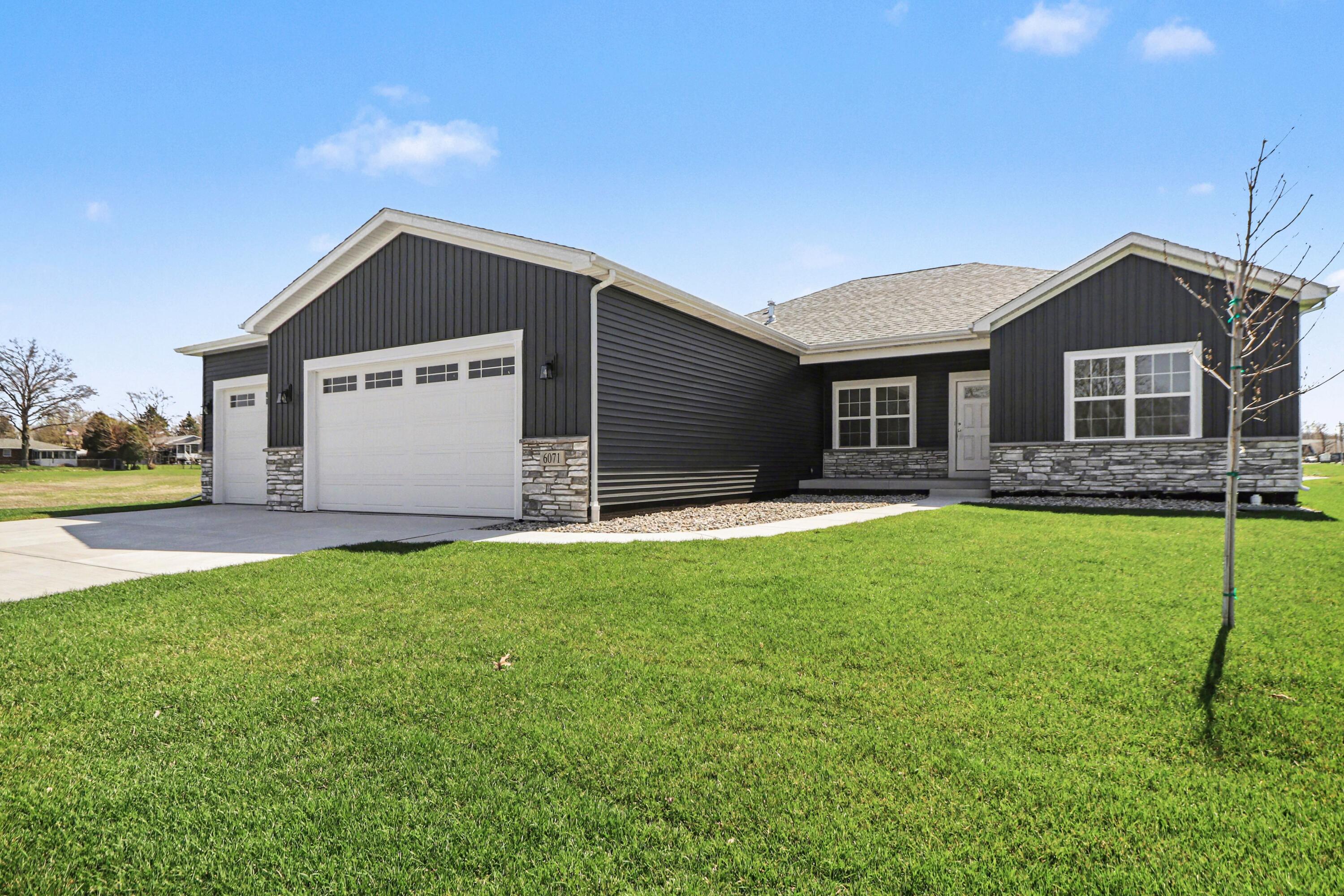 6071 Robbins Road Portage, IN 46368 - Photo 2 of 14 a front view of house with yard and green space