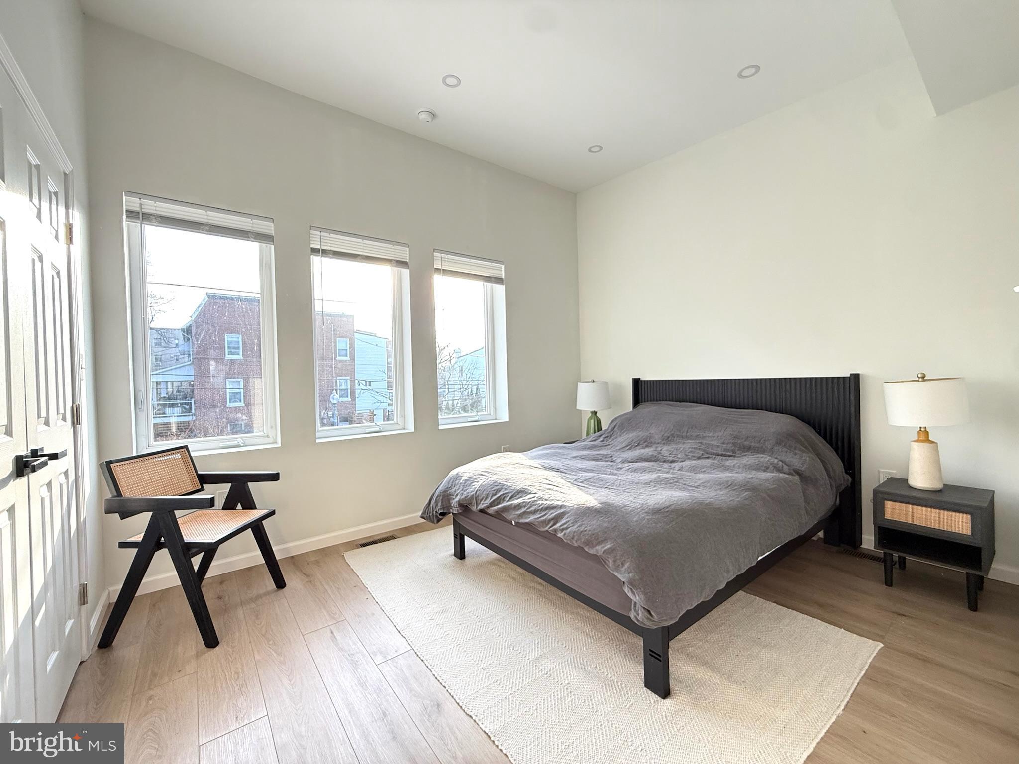 5326 9th Street Northwest Washington, DC 20011 - Photo 17 of 38 a bedroom with a bed and a large window