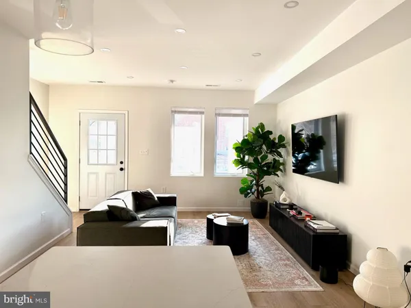 a kitchen with a stove and a refrigerator