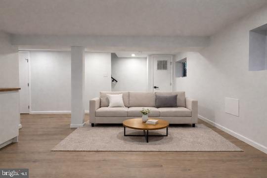 5326 9th Street Northwest Washington, DC 20011 - Photo 33 of 38 a living room with furniture and a couch