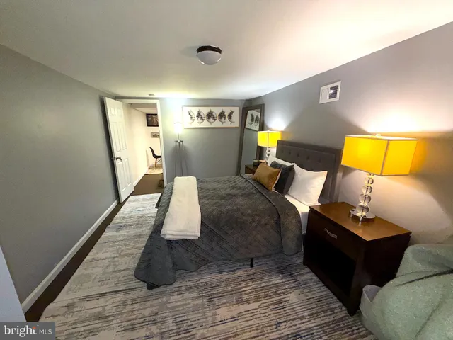 a bed room with a bed and lamp
