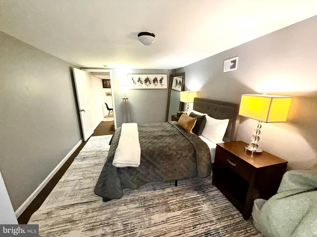 a bed room with a bed and a couch