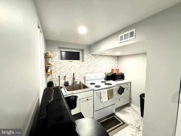 a kitchen with a stove and a microwave