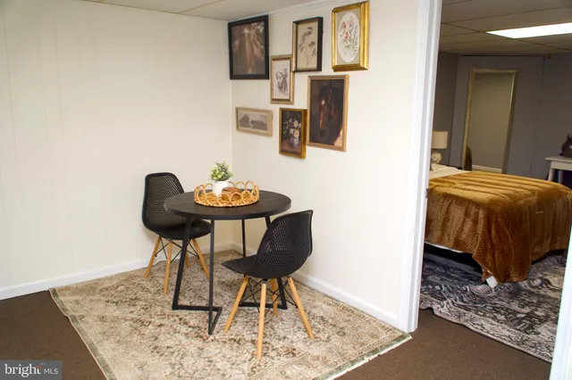 a living room with furniture and a rug