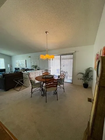 a patio with table and chairs