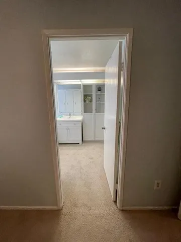 a view of an empty room with a fireplace