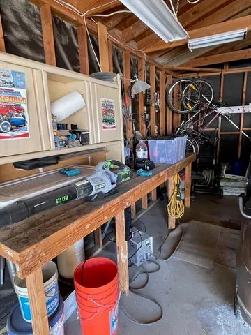 a front view of a room with table and chairs