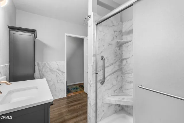 a bathroom with a sink and shower