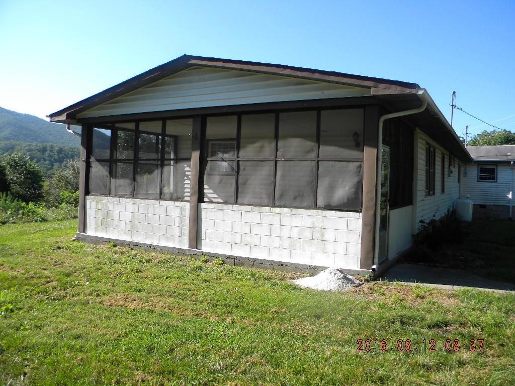 4131 Flatwoods Road Elliston, VA 24087 - Photo 14 of 18 a front view of a house with a yard
