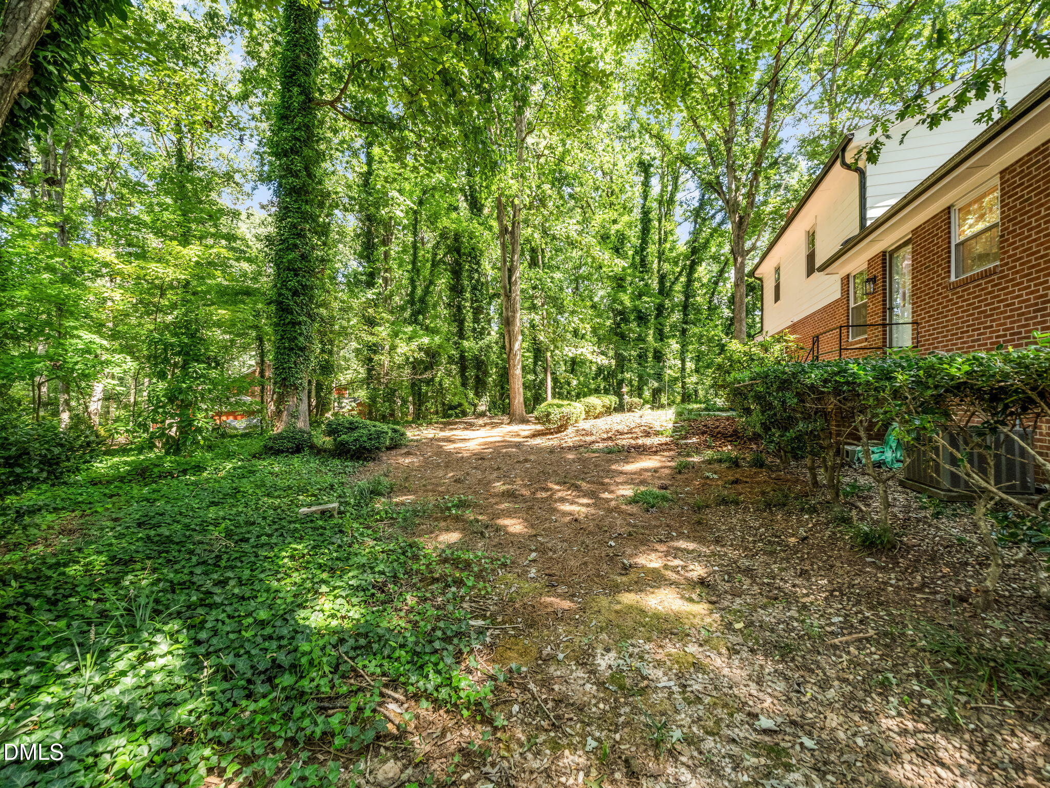 705 Villawood Court Raleigh, NC 27615 - Photo 29 of 31 Another view of the exterior of the home and landscaping.