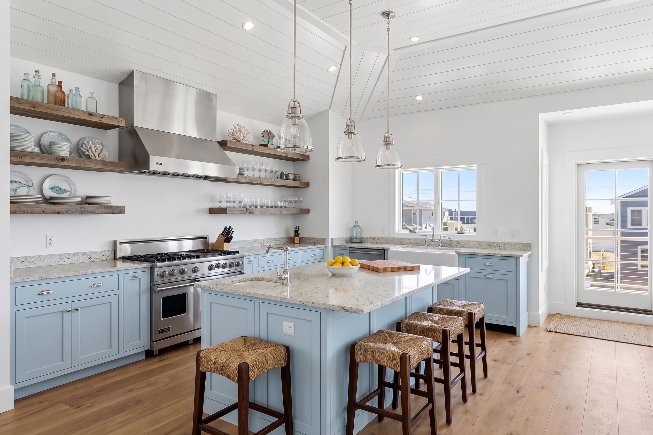 8527 3rd Stone Harbor, NJ 08247 - Photo 5 of 28 a kitchen with stainless steel appliances granite countertop a stove top oven a sink a dining table and chairs with wooden floor