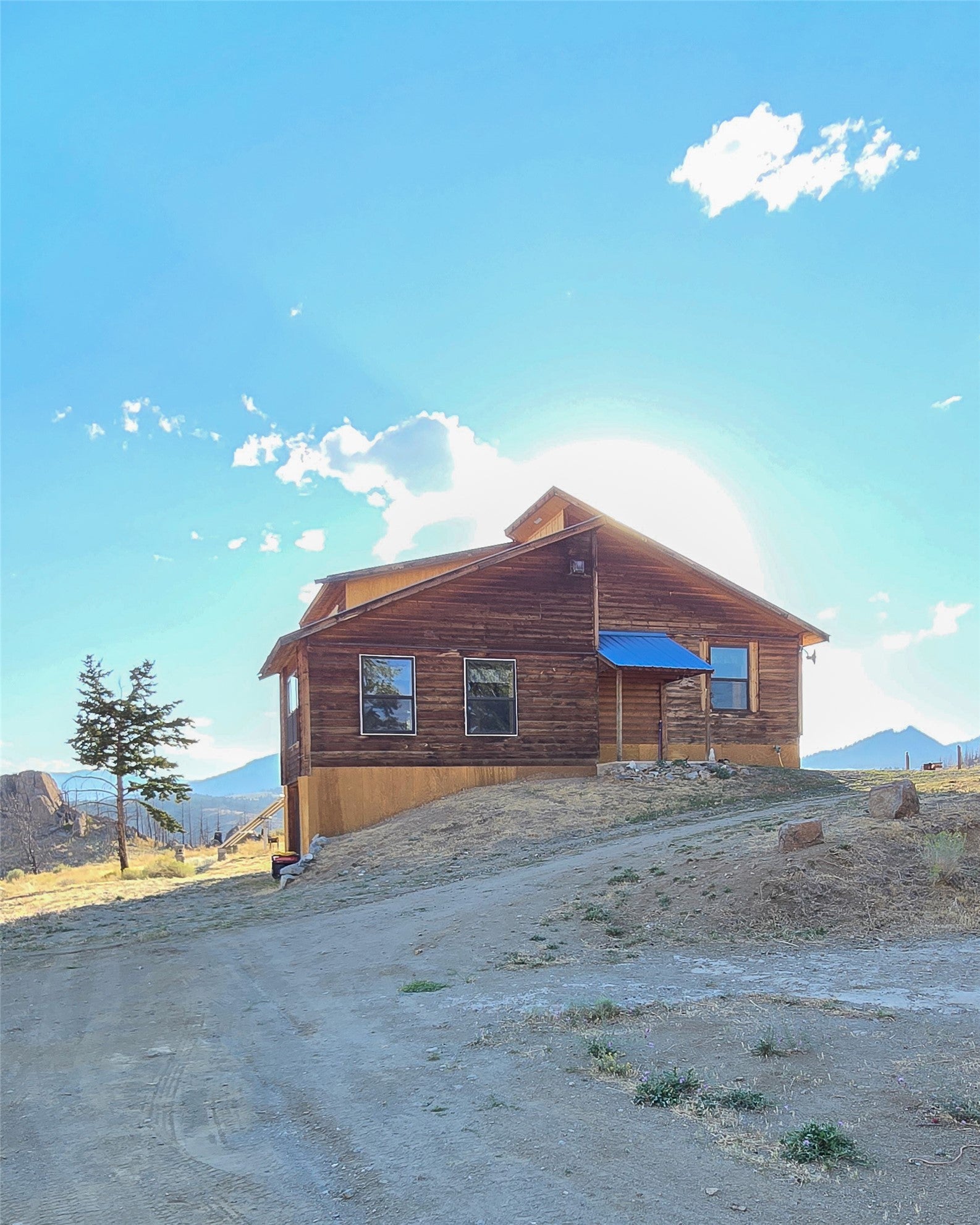 210 Friendspring Road Whitehall, MT 59759 - Photo 25 of 43 View of side of home featuring a mountain view