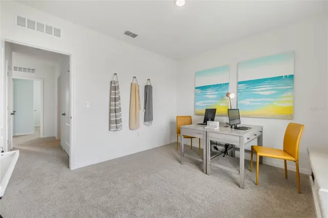 a view of a swimming pool with a lawn chairs and a lawn chairs