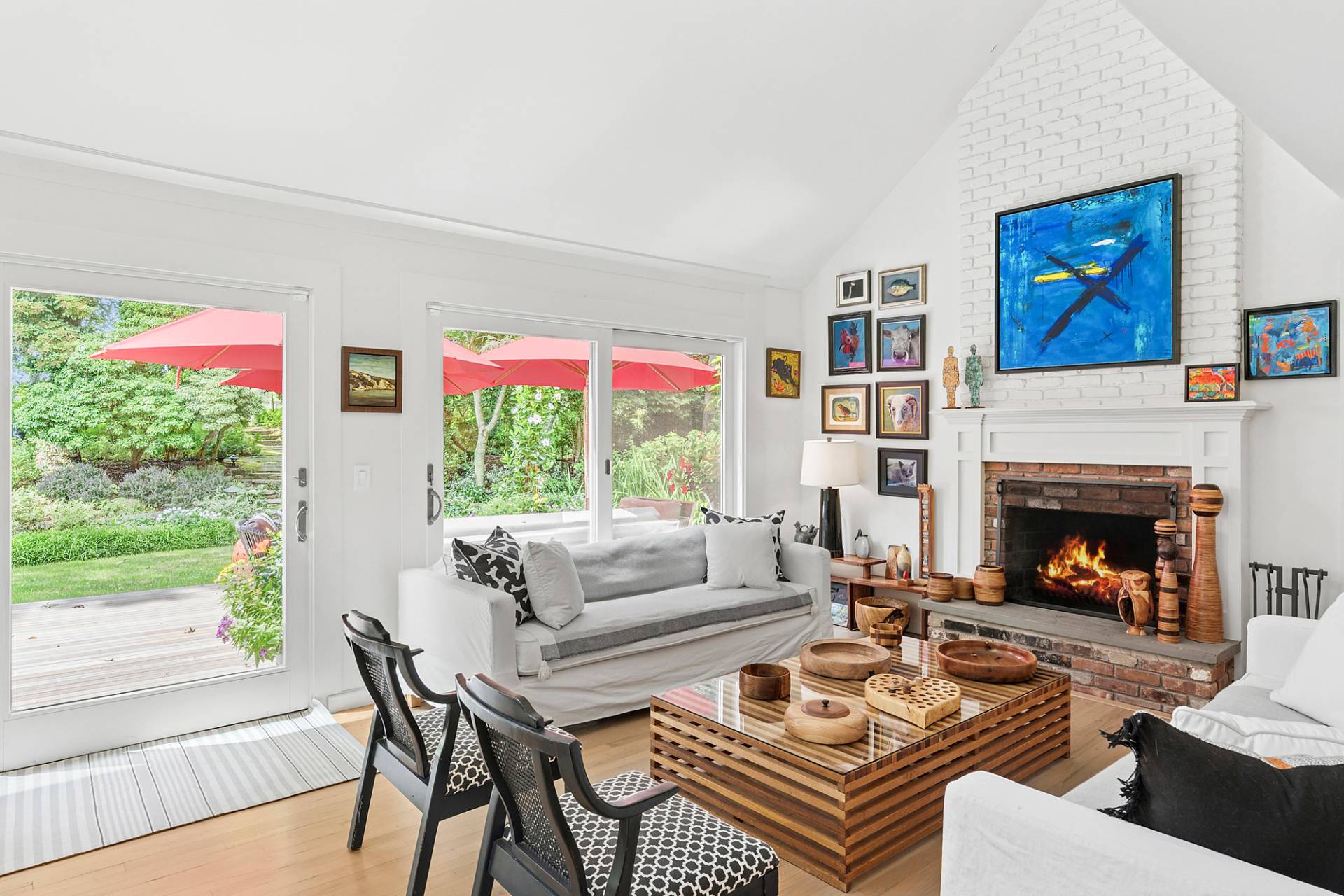 229 Water Mill Towd Road Water Mill, NY 11976 - Photo 12 of 35 a living room with furniture a large window and a fireplace