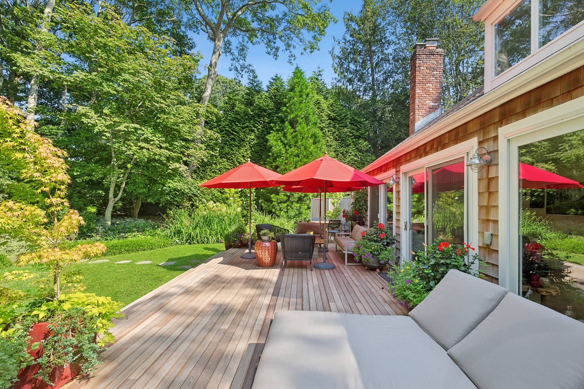 229 Water Mill Towd Road Water Mill, NY 11976 - Photo 15 of 35 a view of a patio with a table and chairs under an umbrella
