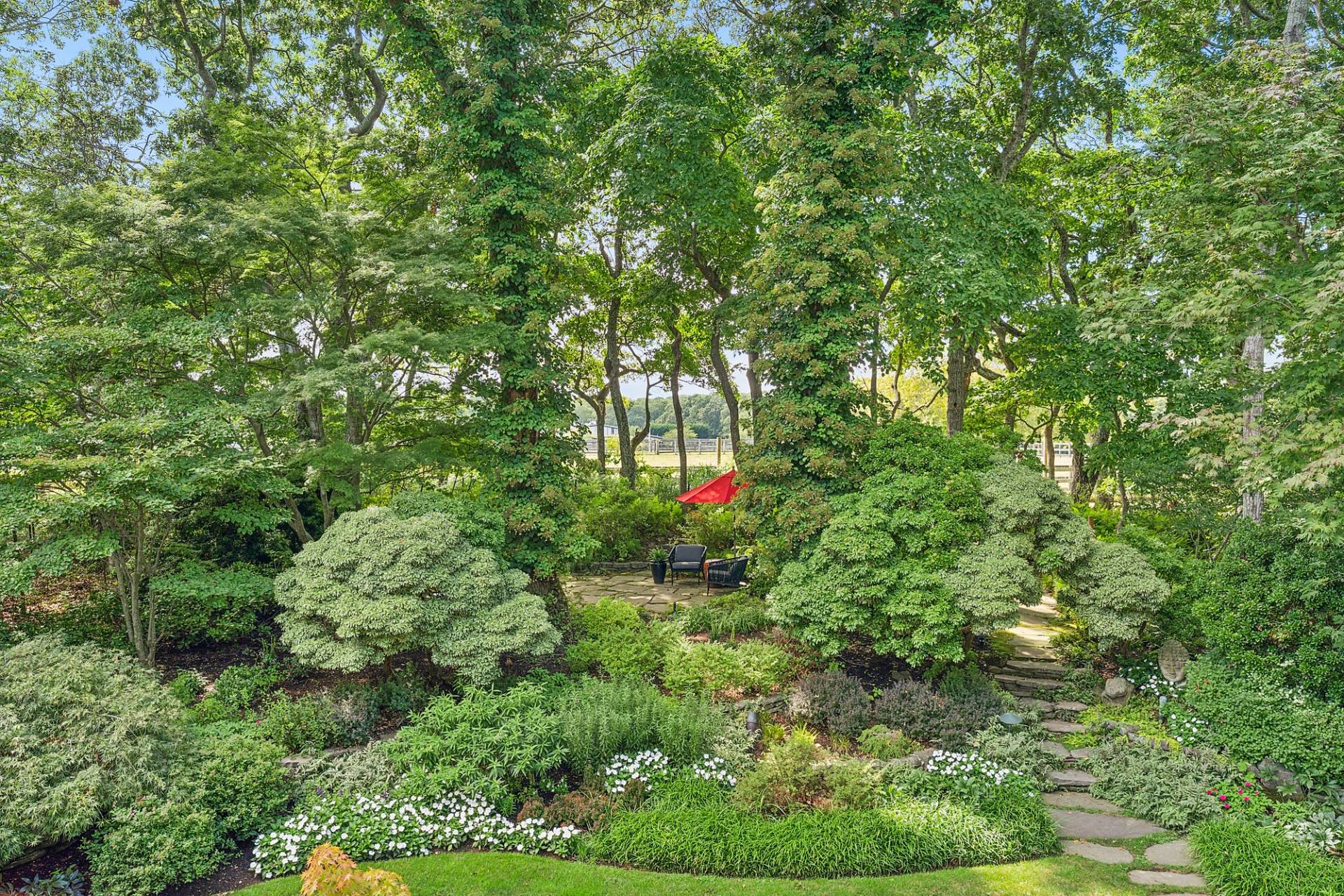 229 Water Mill Towd Road Water Mill, NY 11976 - Photo 19 of 35 a backyard of a house with lots of green space