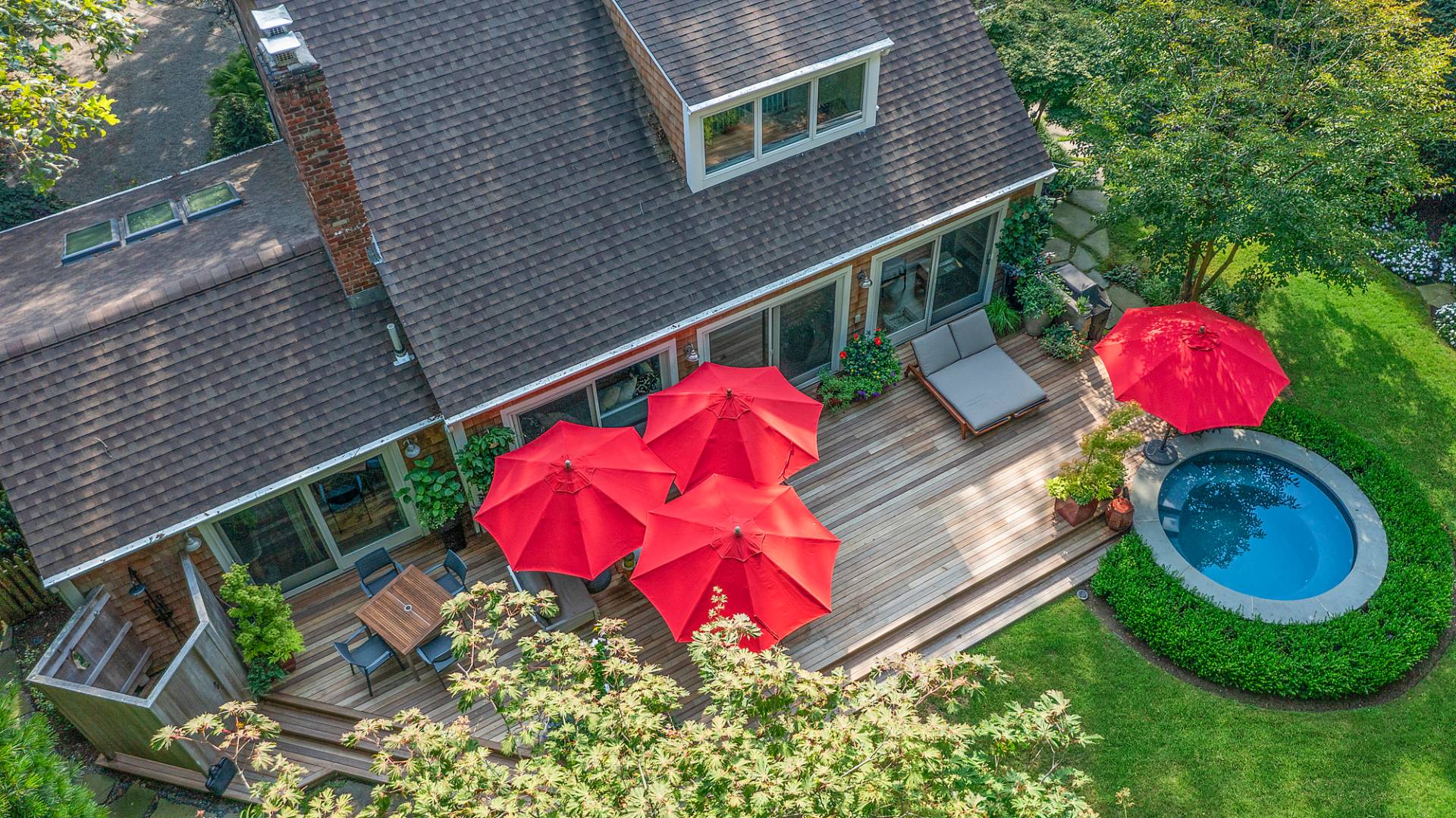 229 Water Mill Towd Road Water Mill, NY 11976 - Photo 20 of 35 a view of backyard with outdoor seating and wooden fence