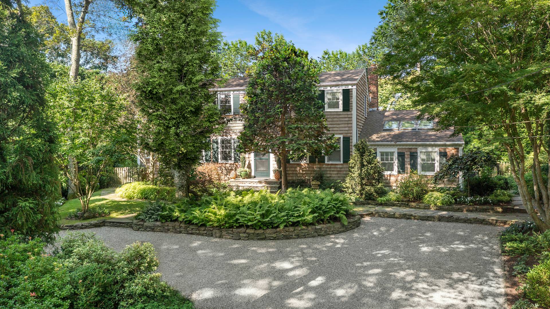 229 Water Mill Towd Road Water Mill, NY 11976 - Photo 2 of 35 front view of a house with a yard