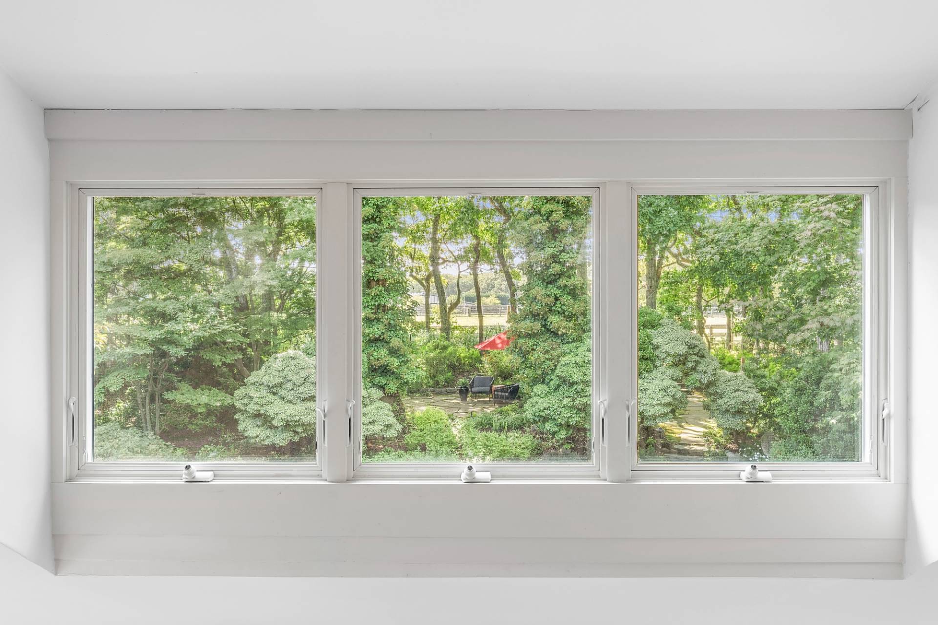 229 Water Mill Towd Road Water Mill, NY 11976 - Photo 23 of 35 a view of a green field with a large window