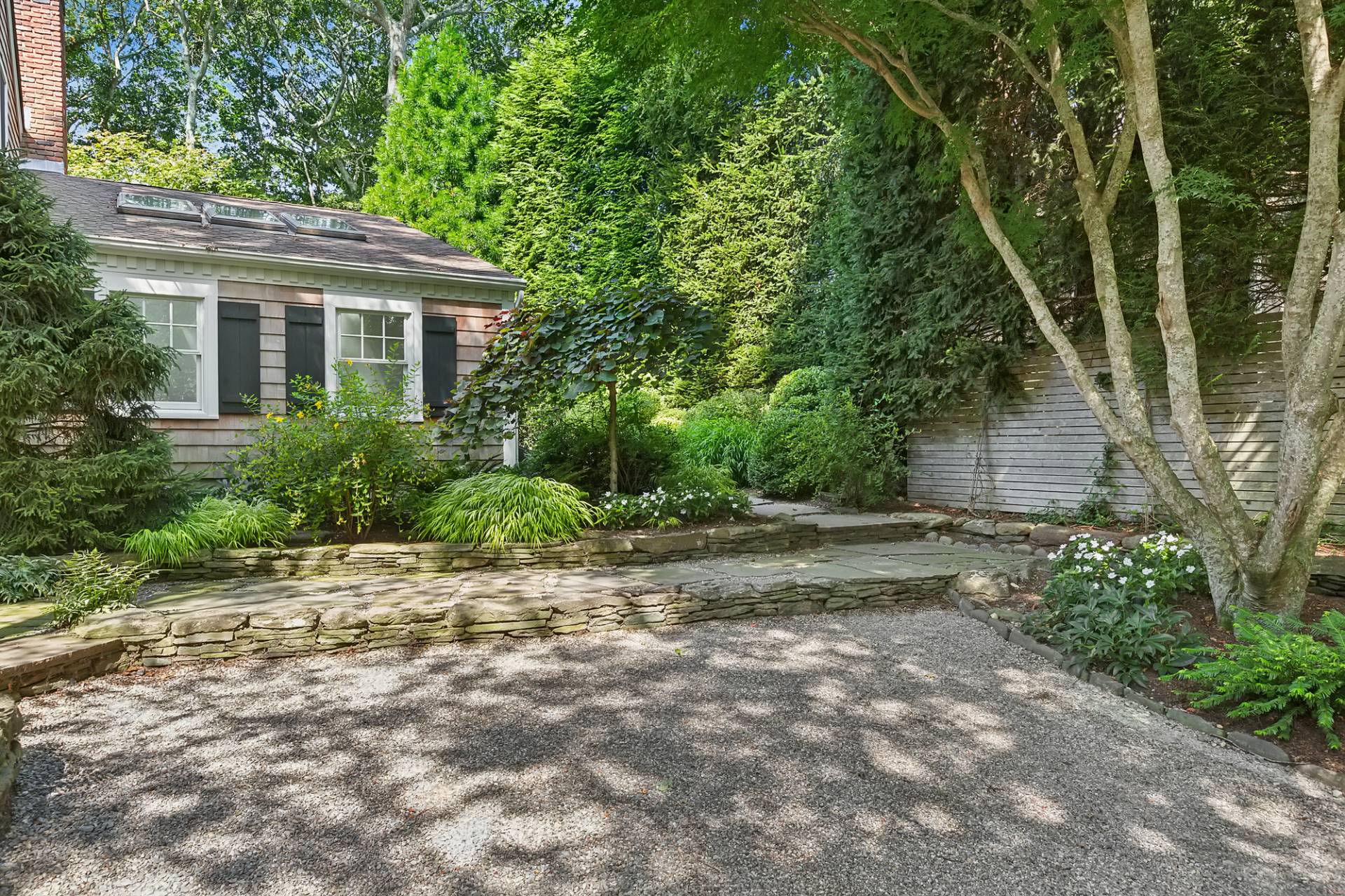 229 Water Mill Towd Road Water Mill, NY 11976 - Photo 28 of 35 a backyard of a house with plants and large tree