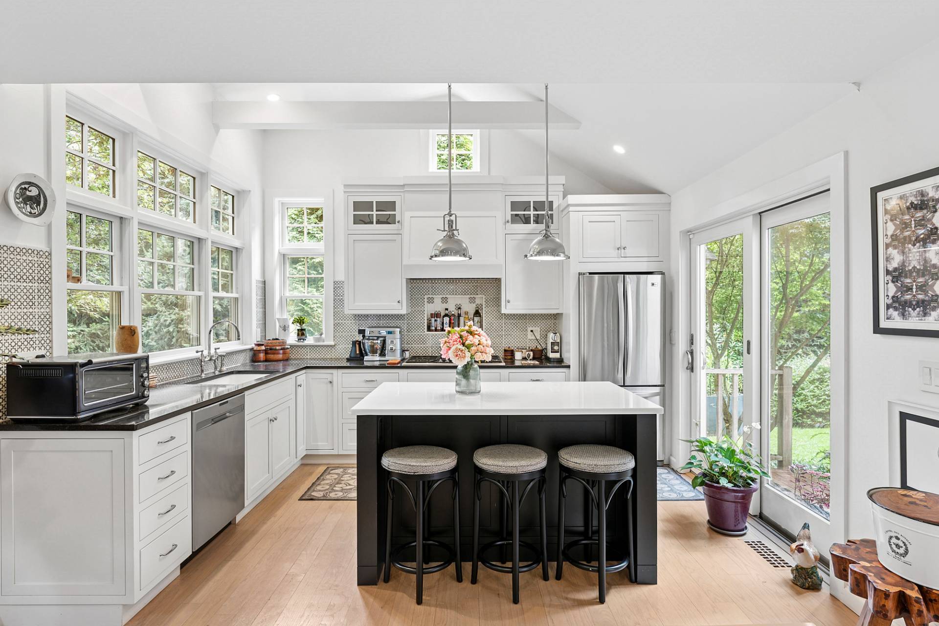 229 Water Mill Towd Road Water Mill, NY 11976 - Photo 8 of 35 a kitchen with a sink a center island cabinets and a window
