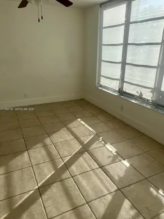 a view of an empty room and window
