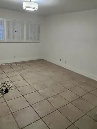 a view of a room and utility area