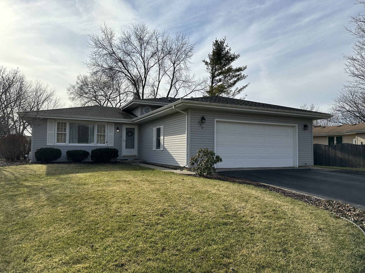 320 Stonegate Road New Lenox, IL 60451 - Photo 1 of 31 a house that has a tree in front of it