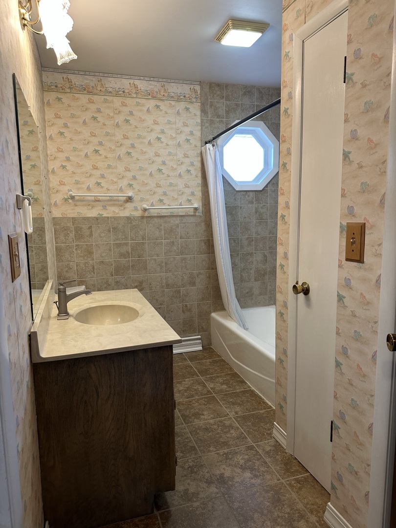 320 Stonegate Road New Lenox, IL 60451 - Photo 15 of 31 a bathroom with a sink a toilet and shower