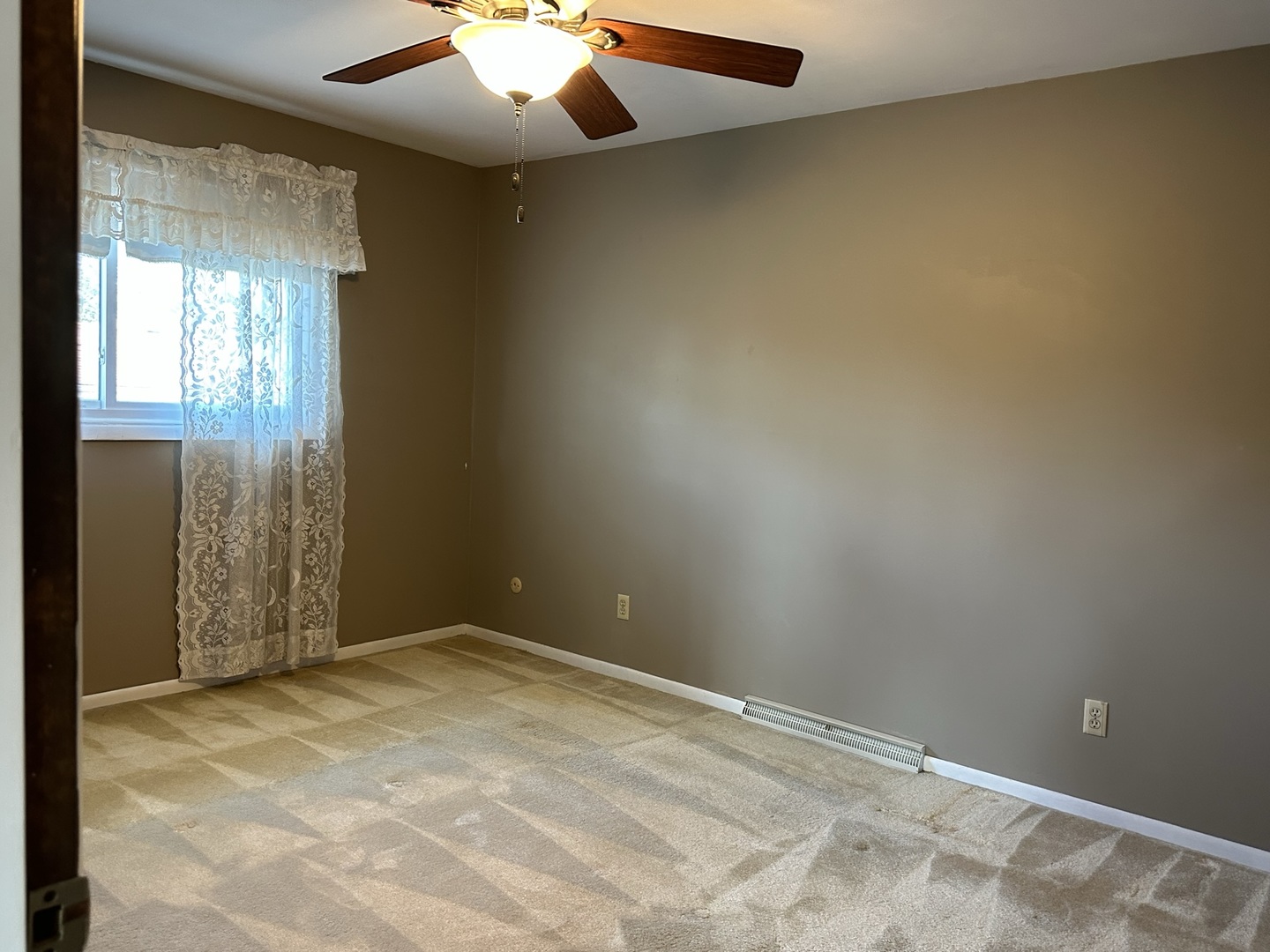 320 Stonegate Road New Lenox, IL 60451 - Photo 16 of 31 an empty room with a chandelier fan