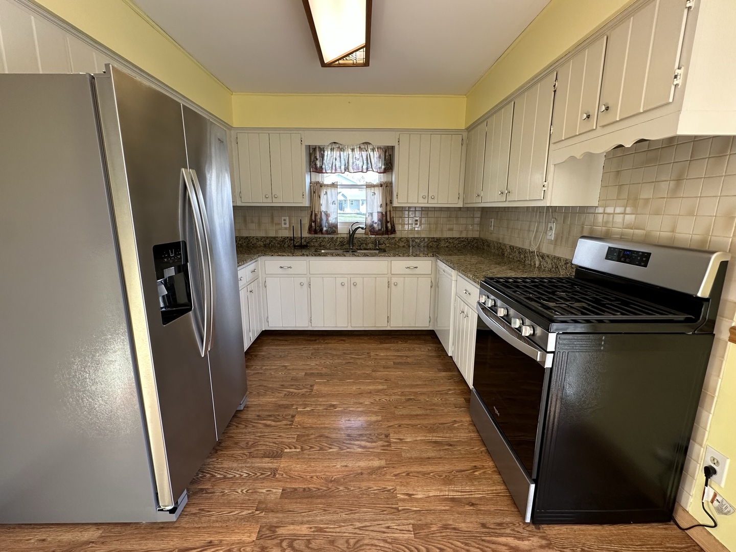 320 Stonegate Road New Lenox, IL 60451 - Photo 8 of 31 a kitchen with stainless steel appliances granite countertop a refrigerator and a stove