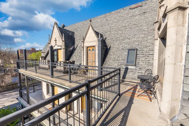 a view of balcony with furniture