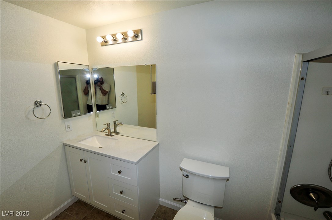 231 West Horizon Ridge Parkway, Unit 1113 Henderson, NV 89012 - Photo 12 of 23 Bathroom with vanity and dark tile patterned floors
