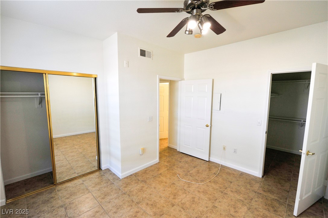 231 West Horizon Ridge Parkway, Unit 1113 Henderson, NV 89012 - Photo 15 of 23 Unfurnished bedroom with baseboards and ceiling fan