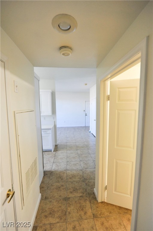 231 West Horizon Ridge Parkway, Unit 1113 Henderson, NV 89012 - Photo 16 of 23 Hallway featuring light tile patterned flooring and a heating unit