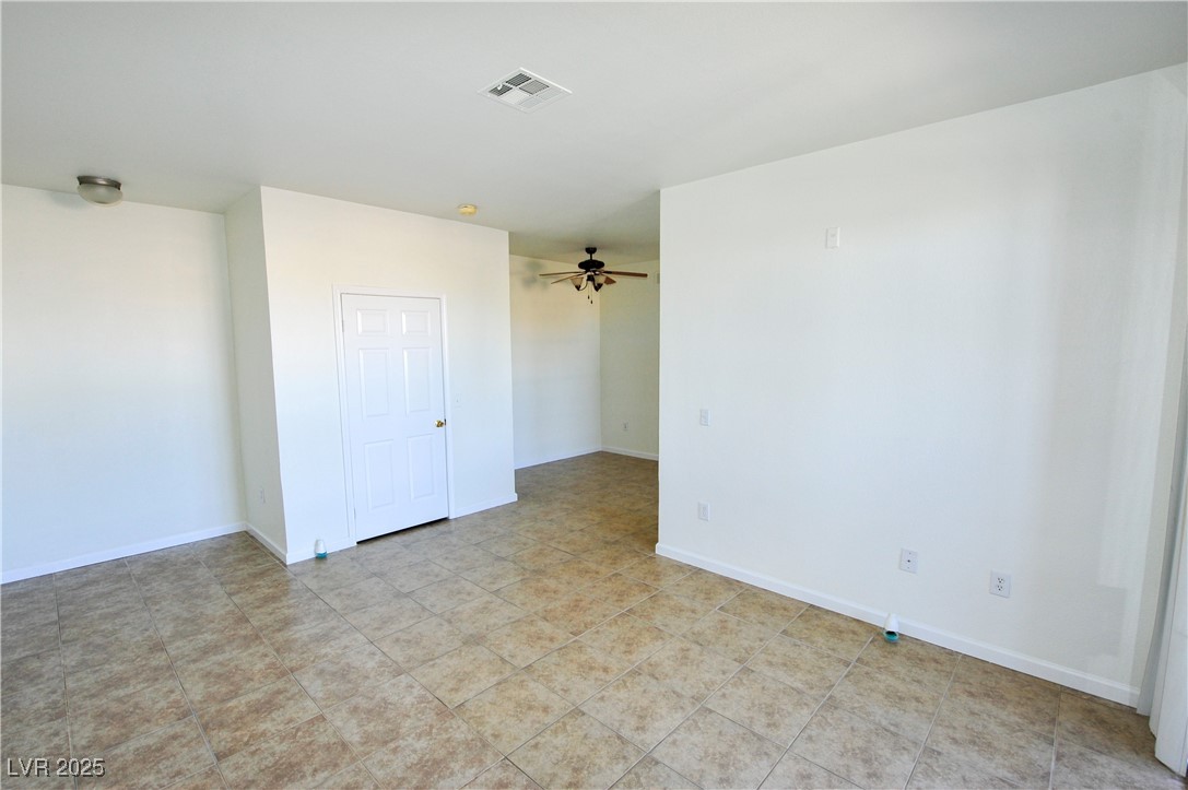231 West Horizon Ridge Parkway, Unit 1113 Henderson, NV 89012 - Photo 5 of 23 Empty room featuring a ceiling fan and light tile patterned flooring