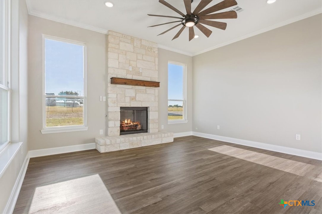 14308 Fm 2904 Temple, TX 76501 - Photo 18 of 45 an empty room with windows and fireplace