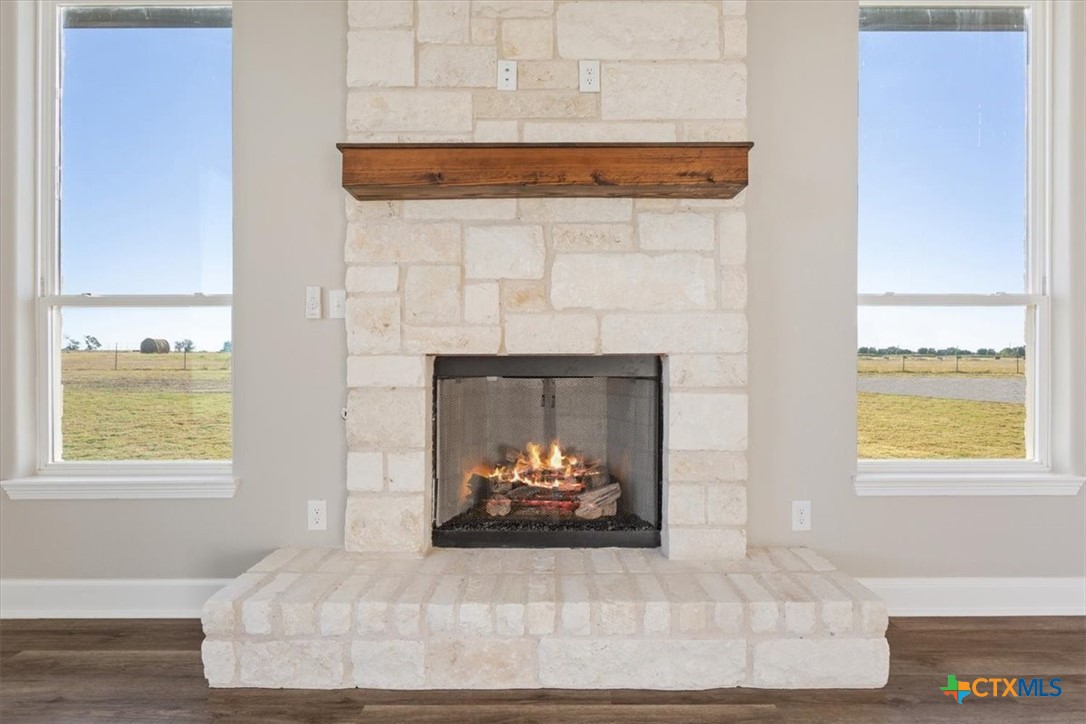 14308 Fm 2904 Temple, TX 76501 - Photo 19 of 45 a living room with a fireplace and a window