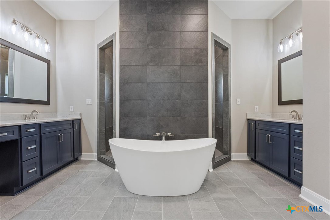 14308 Fm 2904 Temple, TX 76501 - Photo 24 of 45 a spacious bathroom with a tub sink and mirror