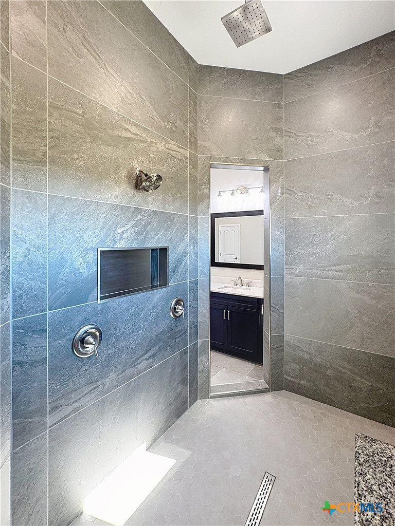 14308 Fm 2904 Temple, TX 76501 - Photo 27 of 45 a bathroom with a shower and mirror
