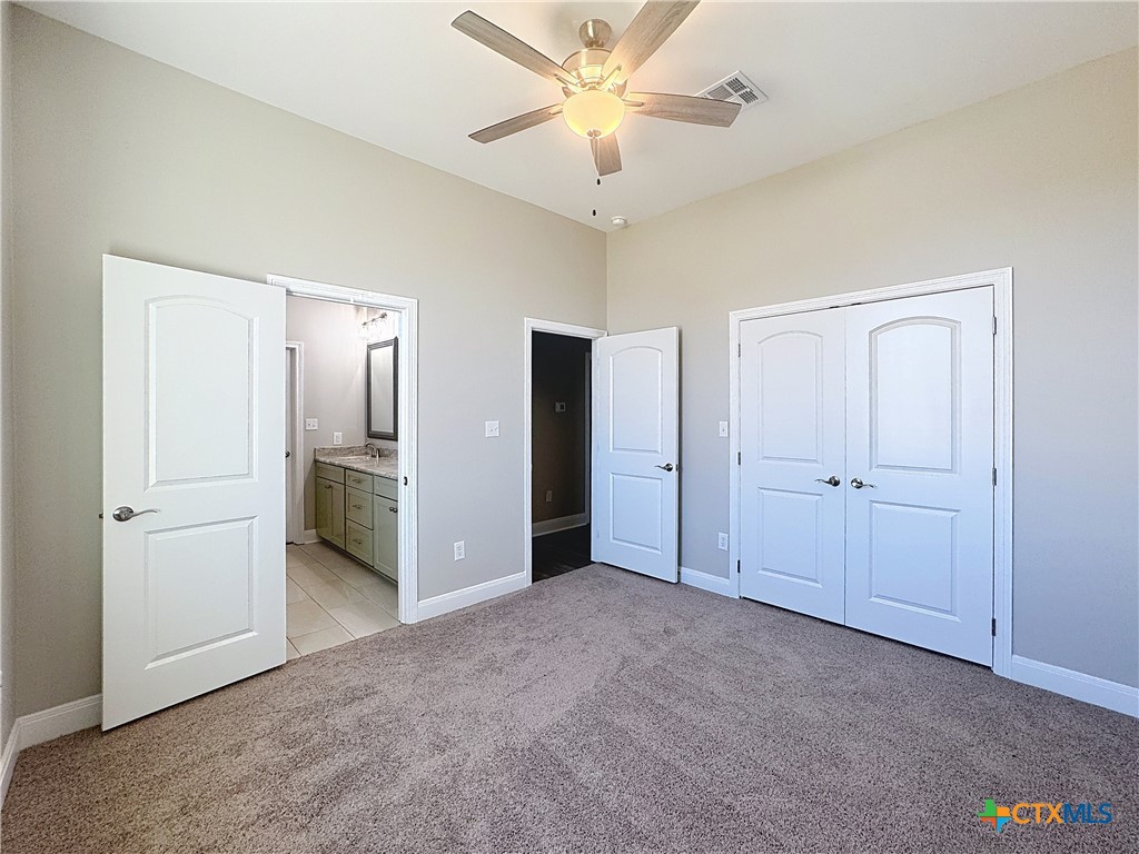 14308 Fm 2904 Temple, TX 76501 - Photo 30 of 45 a view of a room with a ceiling fan and entryway
