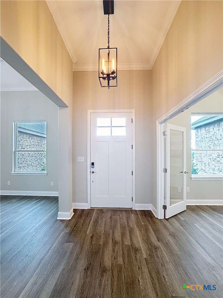 14308 Fm 2904 Temple, TX 76501 - Photo 7 of 45 an empty room with wooden floor and windows
