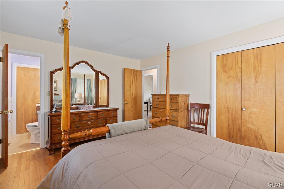 201 Ridgewood Road Easton, PA 18045 - Photo 35 of 46 a bedroom with a large bed and a chandelier
