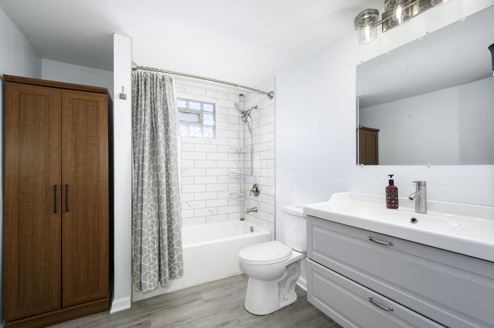 14526 Ridgeway Avenue Midlothian, IL 60445 - Photo 11 of 17 a bathroom with a sink toilet and shower