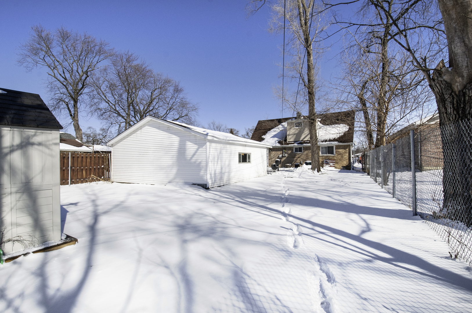 14526 Ridgeway Avenue Midlothian, IL 60445 - Photo 17 of 17 a view of a house with a snow on the road
