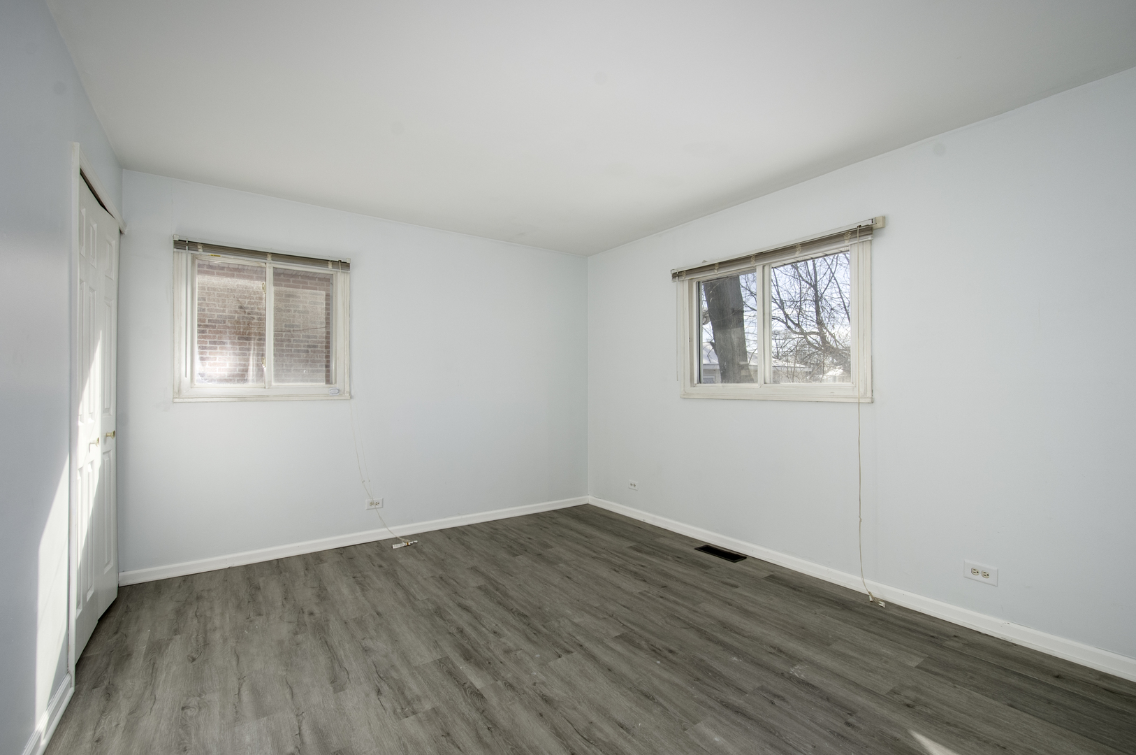 14526 Ridgeway Avenue Midlothian, IL 60445 - Photo 8 of 17 wooden floor in an empty room with a window