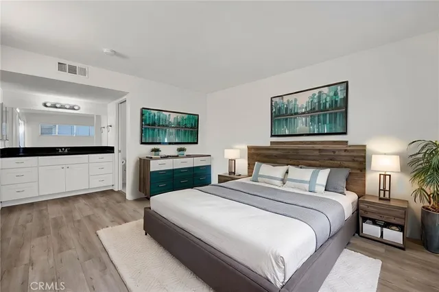 a view of a room with wooden floor and white wall