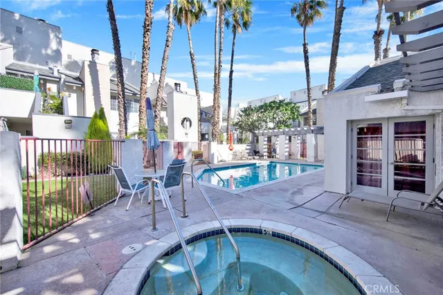 a view of balcony with wooden floor and a potted plant
