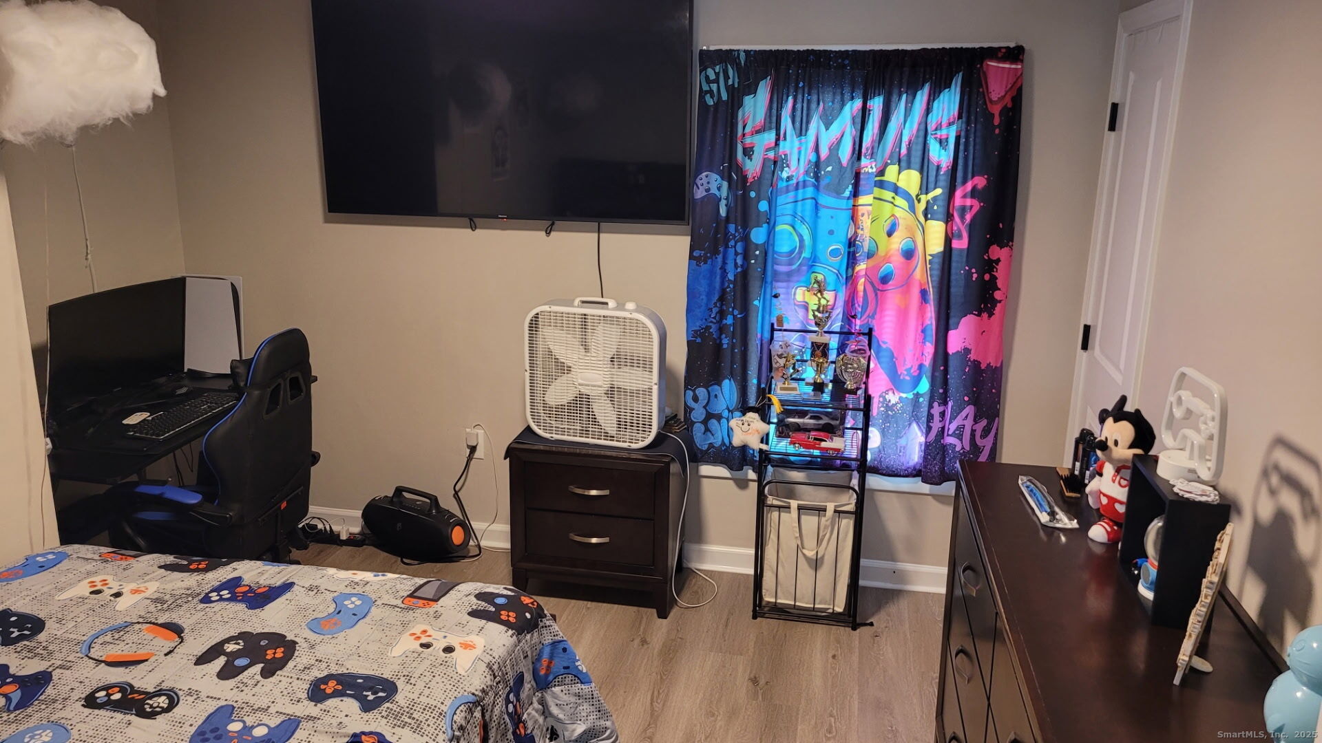 515 Liberty Street, Unit 515 Meriden, CT 06450 - Photo 11 of 11 a bedroom with a bed and wooden floor